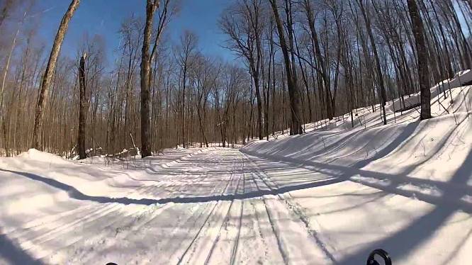 Snowmobilers enjoy the well-maintained trails near Clam Lake. Ashland County offers more than 220 miles of snowmobile trails.